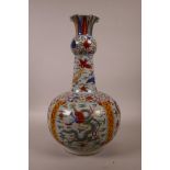 A Chinese polychrome porcelain vase with a frilled rim, decorated with dragons and storks in flight,