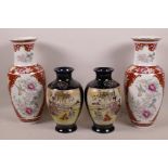 A pair of Japanese Satsuma porcelain vases decorated with panels of figures in garden scenes on a