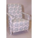 An open arm easy chair, upholstered in a contemporary pattern fabric