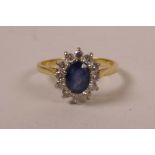 An 18ct gold, diamond and sapphire set Princess Diana ring, approximate size 'Q'