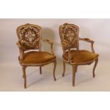 A pair of French style carved show wood open armchairs with brocade upholstered back panel and