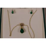 A green and clear gem set 9ct gold pendant on fine gold chain, and a pair of matching earrings