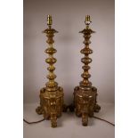 A pair of Italian painted and gilt table lamps on triform bases, 27" high