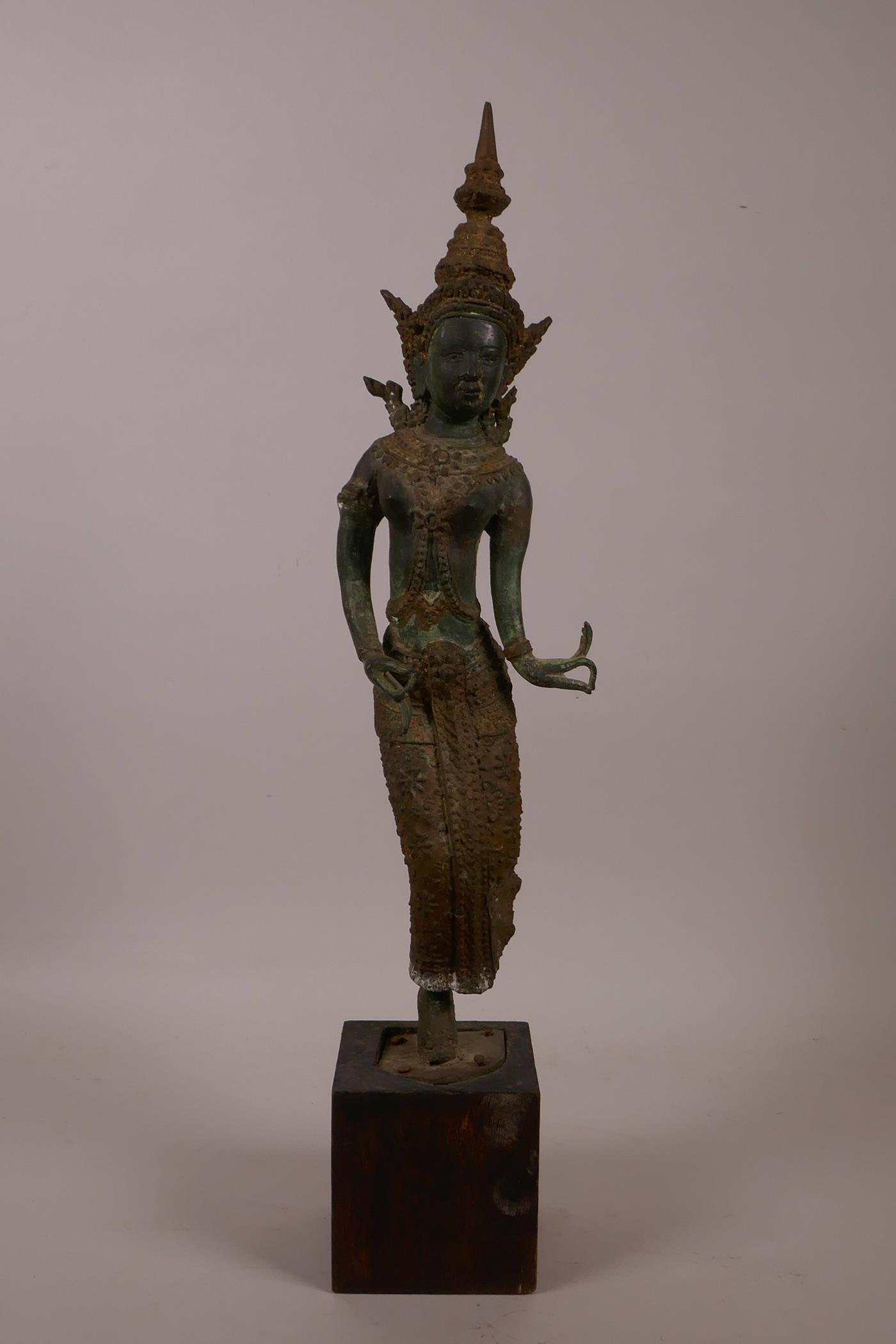 A Thai bronze of a dancer, with verdigris patina, 16" high