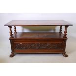 A Colonial, Anglo-Indian rosewood monk's bench, the three panelled back with carved decoration,