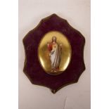 A framed porcelain plaque depicting Christ of the Sacred Heart, within a gilt surround, plaque 4"