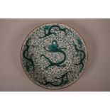 A Chinese porcelain dish with green enamelled dragon decoration, 6 character mark to base, 8"