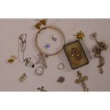 A small quantity of miscellaneous jewellery including a rolled gold bangle, silver heart locket,