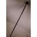 A bamboo walking cane with white metal mount and handle in the form of a die with metal pips, 35"