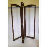 An Italian walnut four fold screen, with neoclassical style carved decoration, raised on castors,