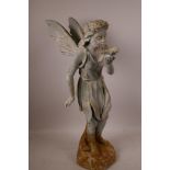 A cast metal garden figurine of a fairy with cupped leaf, 20" high