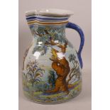 A large Spanish majolica ewer painted with figures in a pastoral scene in bright enamels, 10½" high