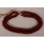 A string of Chinese red agate beads, 25" long