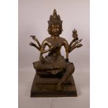 A large Indian bronze of Shiva with four faces seated on a throne, 17½" high