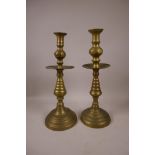 A near pair of brass candlesticks, 14½" high