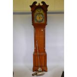 A Maple and Co. oak longcase clock, the hood with broken swan pediment, the brass dial with