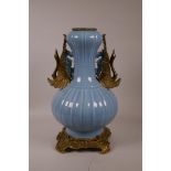 A Chinese duck egg blue glazed vase with ormolu mounts and handles in the form of swans, seal mark