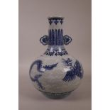 A Chinese blue and white porcelain two handled vase with dragon and phoenix decoration, 6