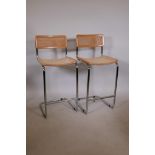 A pair of chrome and beech bar stools with carved seats and backs, 39" high