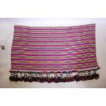 A long Baluch wall hanging with large beaded tassels, 124" x 40"