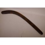 An Aboriginal carved wood hunting boomerang, 28" long