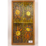 A 1970s ceramic wall plaque, featuring abstract sun shapes in burnt orange against an olive green