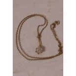 A delicate 15ct gold set diamond pendant necklace on fine gold chain, gross 2.1 grams
