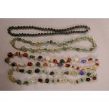 A moss agate bead necklace, 24" long, together with three other hardstone necklaces