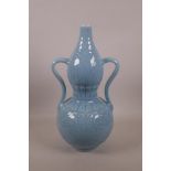 A Chinese duck egg blue glazed porcelain double gourd vase with two handles and underglaze lotus