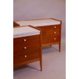 En suite to previous lot, a satinwood and formica dressing table comprising two chests of drawers
