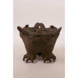 A Chinese bronze censer decorated with three bats, lacks cover, 3½" high x 4½" diameter