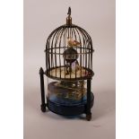 An automata bird cage mantel clock, 7" high
