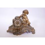 A French brass Rococo style mantel clock surmounted by a putti playing an aulos, with a brass dial