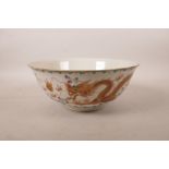 A Chinese polychrome enamelled porcelain bowl decorated with two dragons chasing the flaming