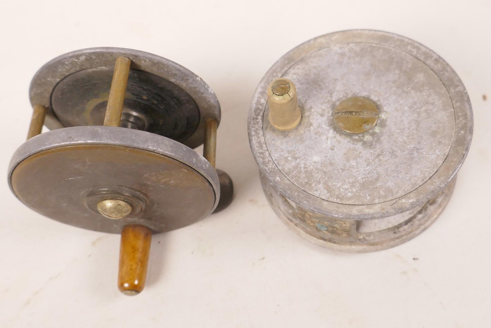 An early J.W. Young & Sons aluminium chalk stream trout fishing reel (corroded), 2½" diameter,