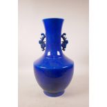 A Chinese blue ground porcelain vase with two handles and underglaze dragon decoration, 6