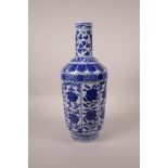 A Chinese blue and white porcelain vase with decorative floral panels, seal mark to base, 13½" high