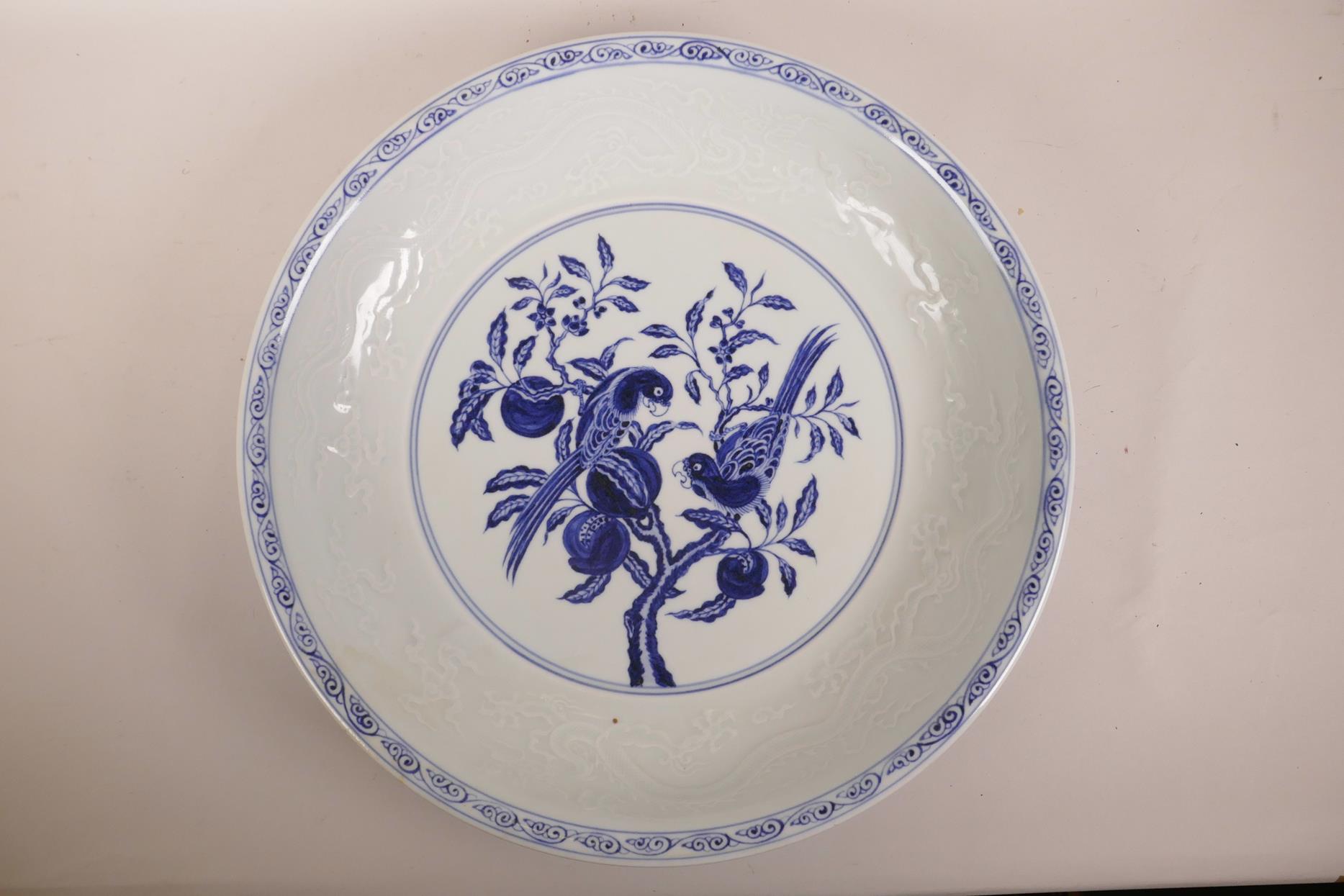 A large Chinese blue and white pottery charger decorated with two birds perched on a pomegranate - Image 2 of 8