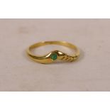 A 9ct yellow gold wishbone style ring set with an emerald, approximate size 'O'