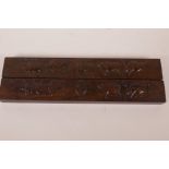A pair of Chinese hardwood scroll weights embossed with images of cattle and calligraphy, 15" long