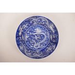 A Chinese blue and white porcelain cabinet plate with a dragon chasing the flaming pearl, 6