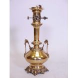 A brass lamp, wired for electricity, 17" high