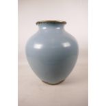 A large Chinese duck egg blue glazed pottery jar with brass mounts, 13½" high