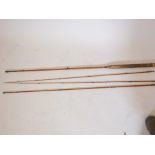 A Hardy Bros split cane three section gold medal fly fishing rod with spare top section, original