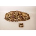 A vintage leopardskin handbag and purse