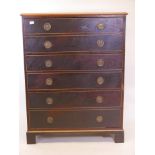 A C19th three drawer laburnum chest with mouldings and brass ring handles, beechwood, raised on