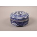 A Chinese blue and white porcelain cup and cover, decorated with a dragon to the cover, 6