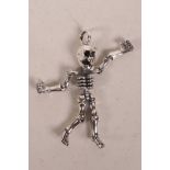 A 925 silver articulated skeleton pendant, 2½"