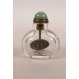 A Chinese glass snuff bottle with a coin inside, 2" high
