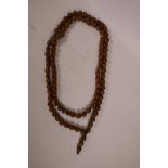 A string of nut kernel kuka prayer beads, 60" long